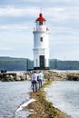 Vladivostok, Russia, 09/20/2017: People walking at the lighthouse. Beautiful landscape