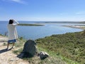 Vladivostok, Russia, September, 22,09, 2023. Woman admires Akhlestyshev Bay from a high point in autumn