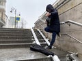 Vladivostok, Russia, March, 04,2020. Street musician plays in an underground passage on Svetlanskaya street in a snowfall. City of