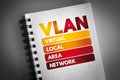 VLAN - Virtual Local Area Network acronym on notepad, technology concept background
