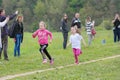 Vlasotince, Serbia - 20 april 2019: young smiling preschool girls running and having fun in the park together