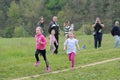 Vlasotince, Serbia - 20 april 2019: young smiling preschool girls running and having fun in the park together