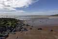 Vlissingen - a beautiful sandy bay a on a small rocky hill. Dramatic clouds in the sky