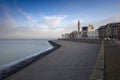 Vlissingen - coastal promenade of standing houses, hotels and restaurants. On the right navigation tower with a lighthouse