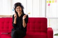 Vlog Asian woman blogger influencer sitting on the sofa in home and recording video blog for teaching and coach her Students or Royalty Free Stock Photo