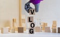 vlog - name from wooden letters. Office desk, informative and communication background Royalty Free Stock Photo