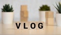 Vlog Spelled with Wood Tiles Isolated on a White Background