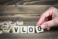 Vlog. Wooden letters on the office desk, informative and communication background Royalty Free Stock Photo