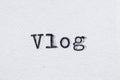Vlog word on white paper printed with typewriter