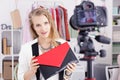 Vlogger holding a bag Royalty Free Stock Photo