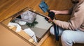 Vlogger influencer filming in libing room the unboxing of new vintage wooden