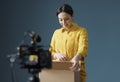 Vlogger making an unboxing video for her channel Royalty Free Stock Photo