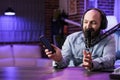 Vlogger reviews smartphone in studio