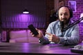 Vlogger reviews smartphone in studio