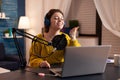 Vlogger speaking with follower on live using professional microphone Royalty Free Stock Photo