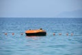 Vlora,Albania. August 2017 : A boy in a colorful inflated trendy floating in a fresh blue sea.