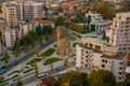 VLORA, ALBANIA: Cityscape seen from Kuzum Baba hill. Aerial city view, city panorama of Vlore at sunset. Royalty Free Stock Photo