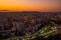 VLORA, ALBANIA: Cityscape seen from Kuzum Baba hill. Aerial city view, city panorama of Vlore at sunset. Royalty Free Stock Photo