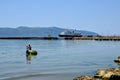 Two fishermen with fishing net at the Adriatic sea coast in the city of Vlore / Vlora, Albania Royalty Free Stock Photo