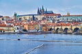 Vltava against the Charles Bridge and St Vitus Cathedral, Prague, Czechia Royalty Free Stock Photo