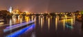 Vltava River with boat neon light lines and Charles Bridge with Old Town Bridge Tower by night, Prague, Czechia. UNESCO Royalty Free Stock Photo