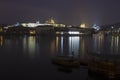 Vltava river, boats and Prague castle after dark Royalty Free Stock Photo