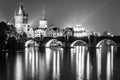 Vltava River and Charles Bridge with Old Town Bridge Tower by night, Prague, Czechia. UNESCO World Heritage Site Royalty Free Stock Photo