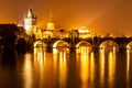 Vltava River and Charles Bridge with Old Town Bridge Tower by night, Prague, Czechia. UNESCO World Heritage Site Royalty Free Stock Photo