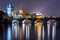 Vltava River and Charles Bridge with Old Town Bridge Tower by night, Prague, Czechia. UNESCO World Heritage Site Royalty Free Stock Photo