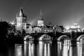 Vltava River and Charles Bridge with Old Town Bridge Tower by night, Prague, Czechia. UNESCO World Heritage Site Royalty Free Stock Photo