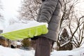 VMan shoveling and removing snow in front of his house in the suburb. Royalty Free Stock Photo