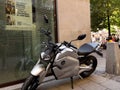 Vmoto Super Soco electric motorcycle parked in city center near