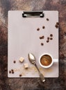 Vntage clipboard, cup coffee and coffee beans