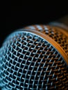 Vocal microphone macro over dark background Royalty Free Stock Photo