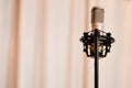 Microphone standing over the pink curtain