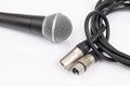 Vocal microphone with xlr mic cable isolated above white background Royalty Free Stock Photo