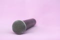 Vocal silver microphone wireless for audio recordings, karaoke on pink background