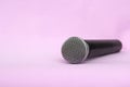 Vocal silver microphone wireless for audio recordings, karaoke on pink background Royalty Free Stock Photo