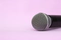 Vocal silver microphone wireless for audio recordings, karaoke on pink background