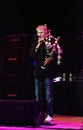 Vocalist Dan Mccafferty playing bagpipes