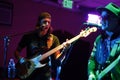 Vocalist singing and playing the guitar during a live Rock and Roll concert at a bar Royalty Free Stock Photo