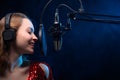 Vocalist sings in studio. Vocal and music, professional singing and skills