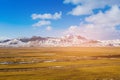 Vocalno mountain with snow over green glass land skyline Royalty Free Stock Photo