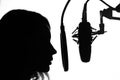 Vocals with studio microphone, silhouette. Black and white photo Royalty Free Stock Photo