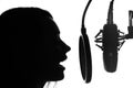 Vocals with studio microphone, silhouette. Black and white photo Royalty Free Stock Photo