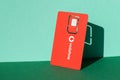 Vodafone red sim card on a green background