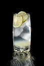 Vodka lime, gimlet or gin tonic with ice in rocks glass on black background-2. Royalty Free Stock Photo