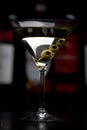 Vodka martini cocktail with olives in bar on black Royalty Free Stock Photo