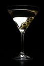 Vodka martini cocktail with olives isolated on black Royalty Free Stock Photo