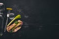 Vodka and a set of sandwiches with sprats, and caviar, onion and parsley, on a wooden background. Royalty Free Stock Photo